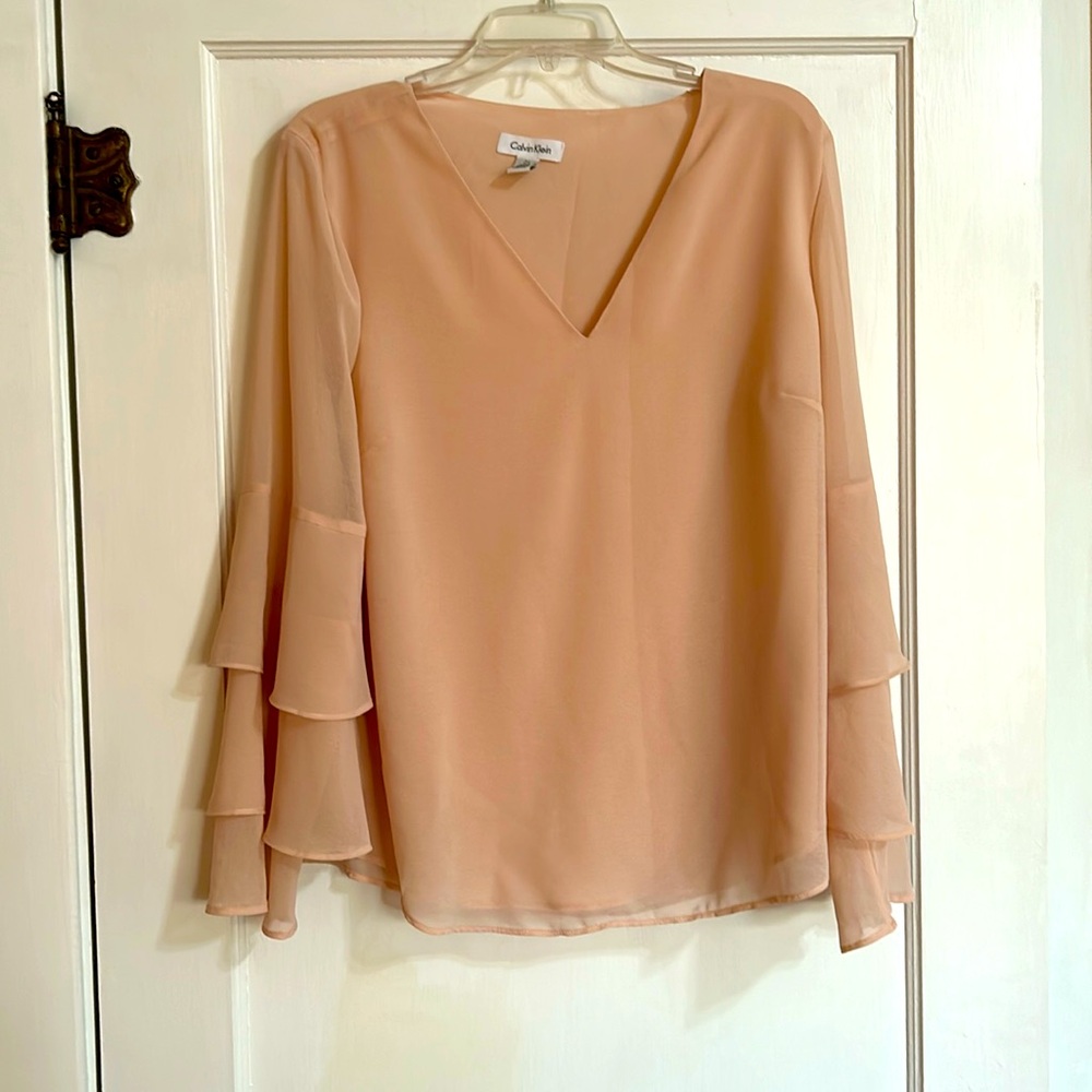 Calvin Klein peach flowy blouse with three tier trumpet sleeves. L